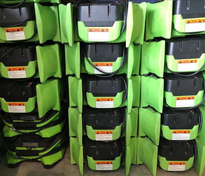 stacked low profile air movers in warehouse