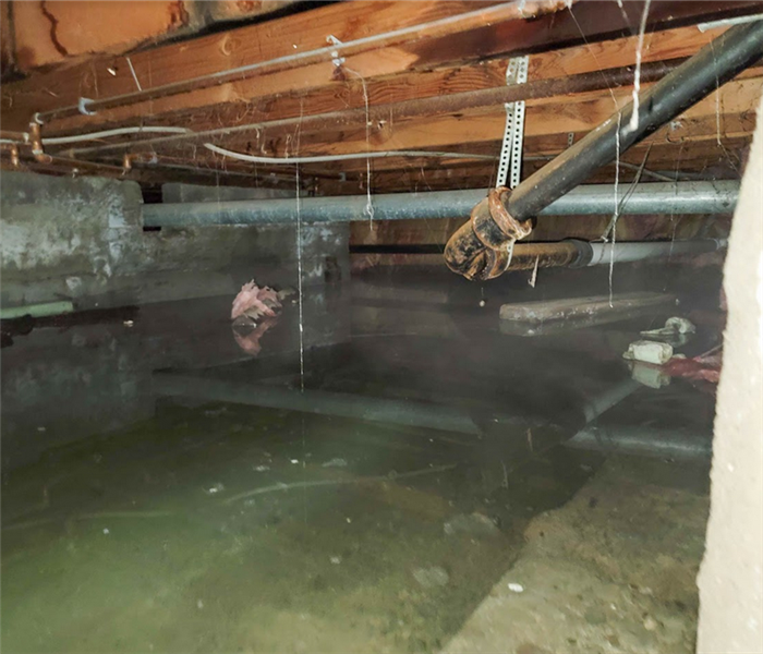 a flooded crawlspace with water everywhere