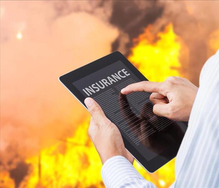 blaze in background, insurance tablet